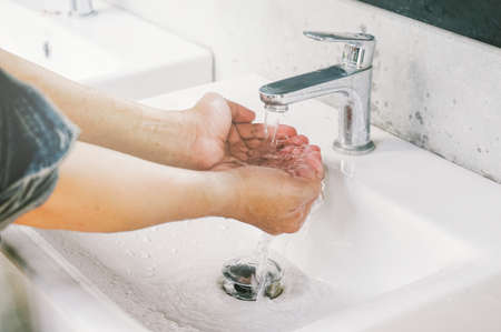 Close up Hand washing at 
Public toiletの写真素材