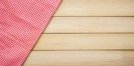 Classic pink tablecloth on wood plank with copy spaceの写真素材
