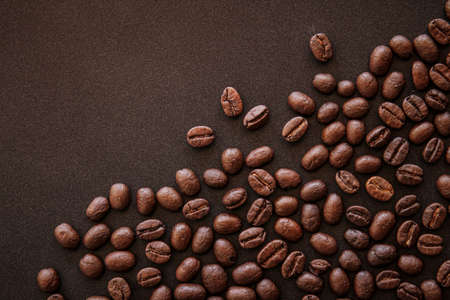 Roasted coffee beans on black background