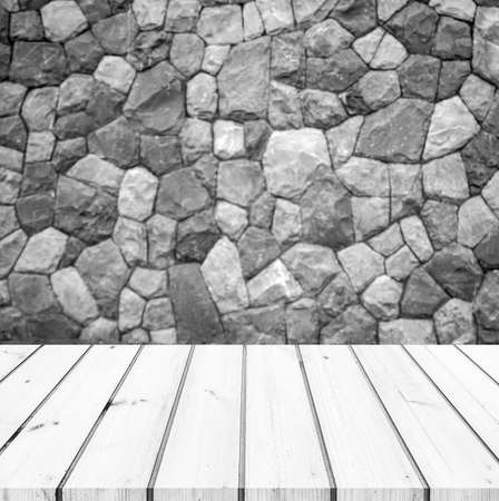 wood plank or wood table with abstract unshape stone wall background for product displayの写真素材