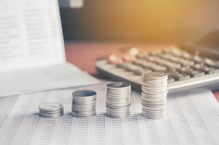 stacks of money coin background concept saving money with vintage filterの写真素材