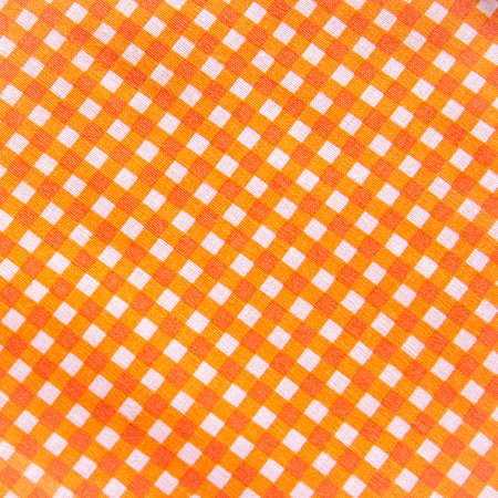 Classic orange plaid fabric or tablecloth backgroundの写真素材