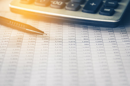Pen and Calculator on accounting report, Business and Financial concept.の写真素材