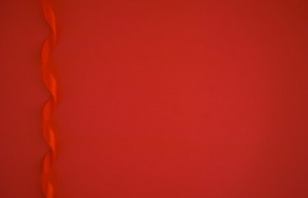 Red paper with red satin ribbon frame, Love or Gift backgroundの写真素材