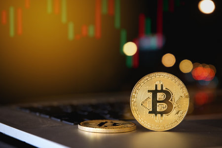 Gold bitcoin on computer laptop with trading graph, Cryptocurrency Concept.の写真素材