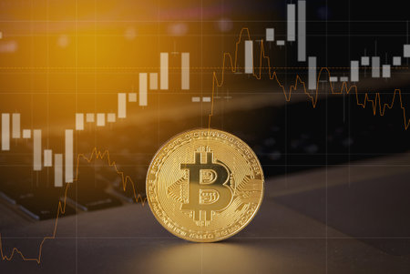 Gold bitcoin on computer laptop with trading graph, Cryptocurrency Concept.の写真素材