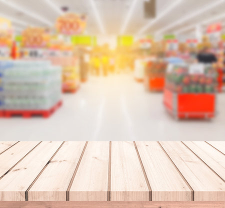 Wood table or Wood floor with supermarket or superstore blur background for product displayの写真素材