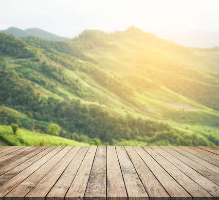 Wood desk or wood floor for product display with mountain view backgroundの写真素材