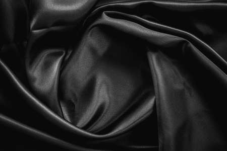 Wrinkle black satin cloth texture backgroundの写真素材