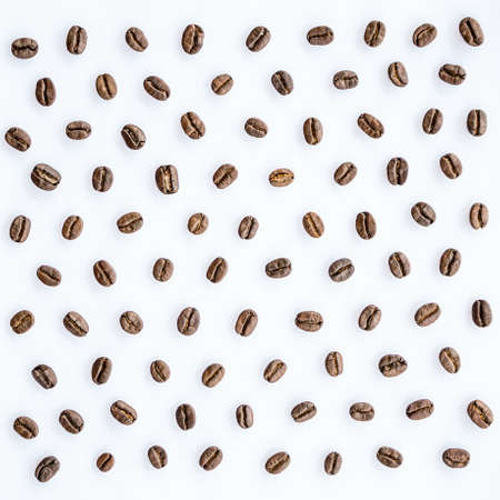 Pattern of roasted coffee beans arrange on white backgroundの写真素材