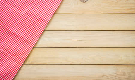 Classic pink plaid fabric or table cloth on wood plank with copy spaceの写真素材