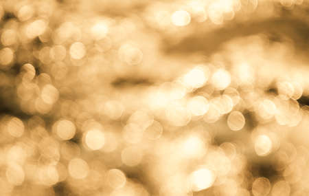Abstract orange or gold bokeh backgroundの写真素材
