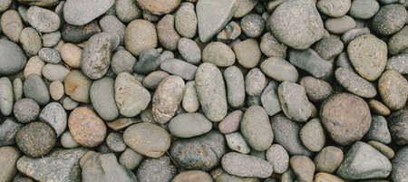 River stone or Pebbles stone background with vintage filterの写真素材