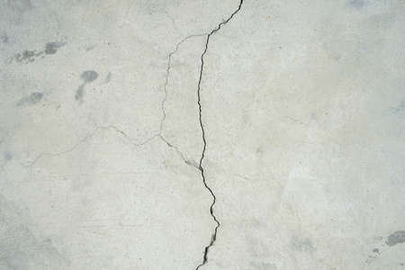 Crack raw cement wall or concrete floor backgroundの写真素材