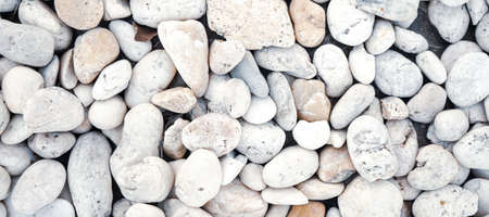 White bebbles stone or river stone  background with vintage filterの写真素材