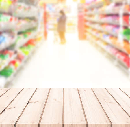 Wood table or Wood floor with supermarket or superstore blur background for product displayの写真素材