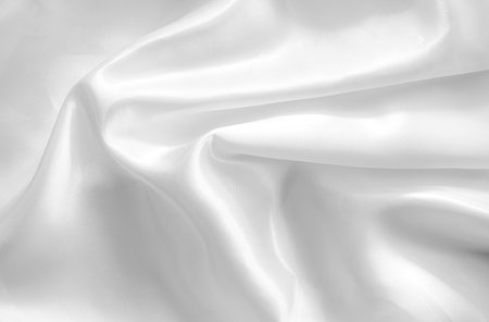 white satin fabric texture background close up with copy space for designの写真素材