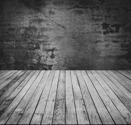 old grunge room with wooden floor, black and white tone.の写真素材