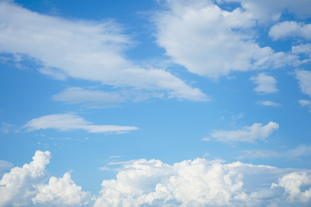 Blue sky background with white clouds. Cumulus white clouds in the blue sky.の写真素材