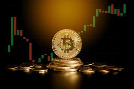Bitcoin gold coin with stock market chart on background. Cryptocurrency concept.の写真素材
