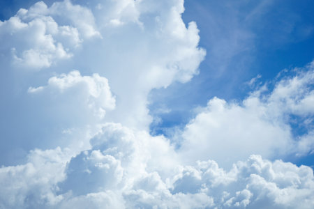 Blue sky background with white clouds. Cumulus white clouds in the blue sky.の写真素材