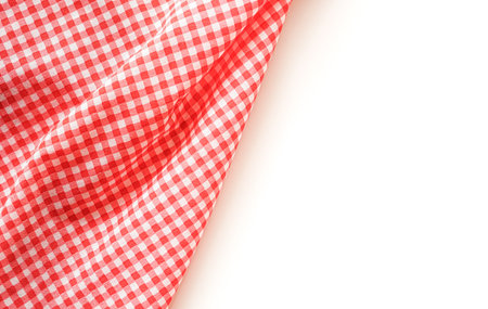 Red checkered tablecloth on white background - soft focus pointの写真素材