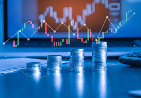 Stacks of coins with stock market or forex trading graph and candlestick chart suitable for financial investment concept.の写真素材