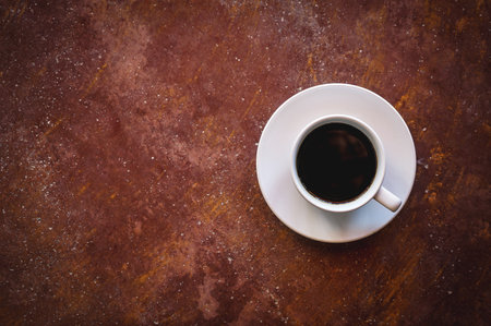 Coffee cup on grunge background, top view, copy spaceの写真素材