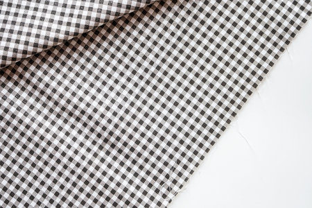 Checkered tablecloth on white background. Top view. Copy space.の写真素材