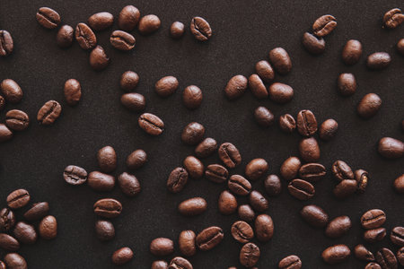Coffee beans on a black background, can be used as a backgroundの写真素材