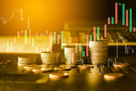 Double exposure of coin stack with stock market or forex trading graph and candlestick chart suitable for financial investment concept.の写真素材