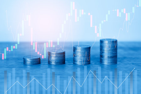 Investment concept, Coins graph stock market financial on blue background.の写真素材