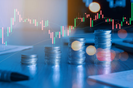 Coins stacks and graph stock market or forex trading graph and candlestick chart suitable for financial investment concept.の写真素材