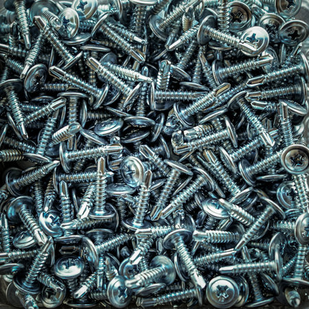closeup of a lot of screws piled up together in a boxの写真素材