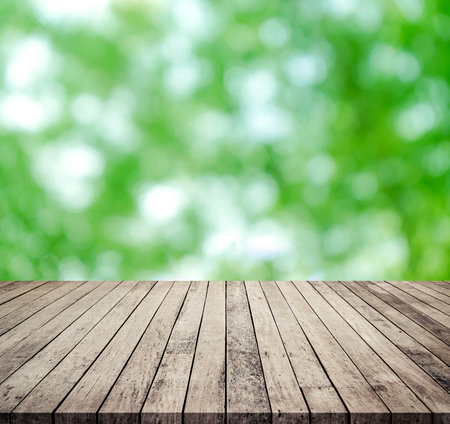 Empty wooden table and green bokeh background, product display montageの写真素材