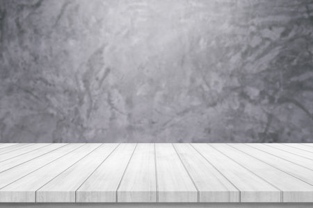 Empty white wood table top on grey cement wall background for product displayの写真素材