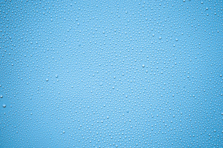 Water drops on blue background. Water drops texture. Water drops backgroundの写真素材