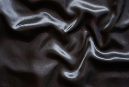 Texture of black satin fabric as background, closeup of photoの写真素材