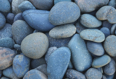 Pebbles on the beach. Blue pebbles background.の写真素材