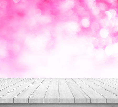Wood table top on blur pink bokeh abstract background - can be used for display or montage your productsの写真素材