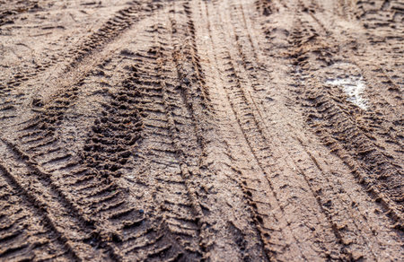 Wheel tracks on the soil. The texture of the soil. Backgroundの写真素材