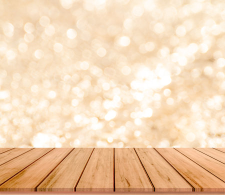 Wooden table top on bokeh abstract background - can be used for display or montage your productsの写真素材