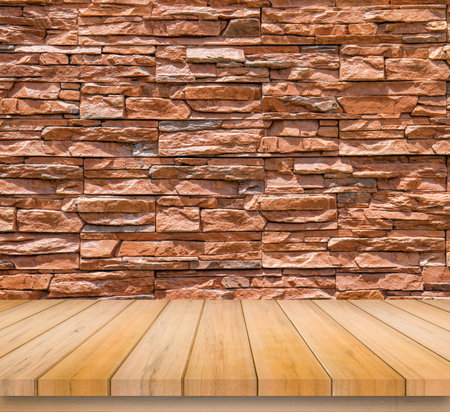Wood table top on brick wall background - can be used for display or montage your productsの写真素材