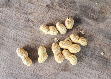 Peanuts in shell on wooden background, Close-up image.の写真素材