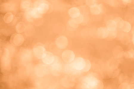 abstract background orange bokeh circles for Christmas and New Yearの写真素材