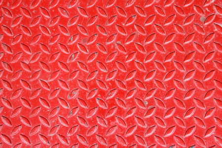 Red metal diamond plate useful as a backgroundの写真素材