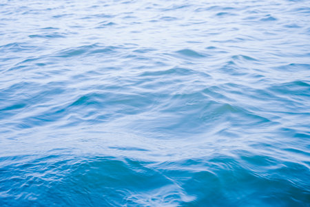 Blue sea water surface texture background. Close up of water surface.の写真素材