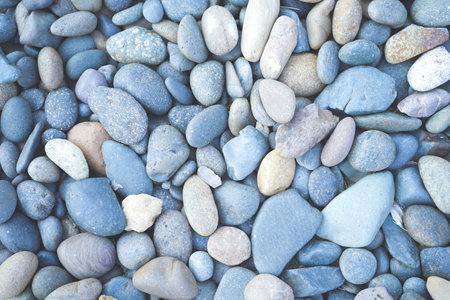 Pebbles on the beach. Sea pebbles background.の写真素材