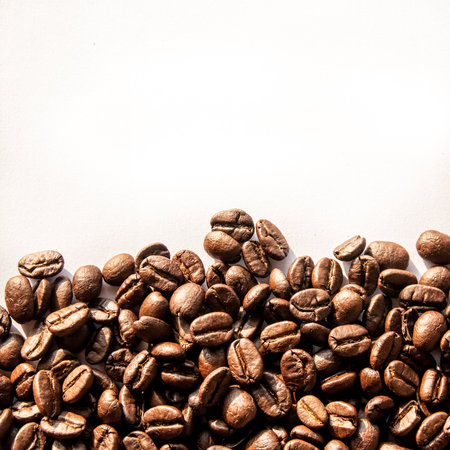 Coffee beans on a white background with copyspace.の写真素材