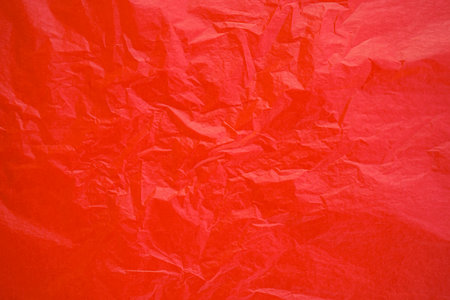Red crumpled paper background. Red crumpled paper texture.の写真素材